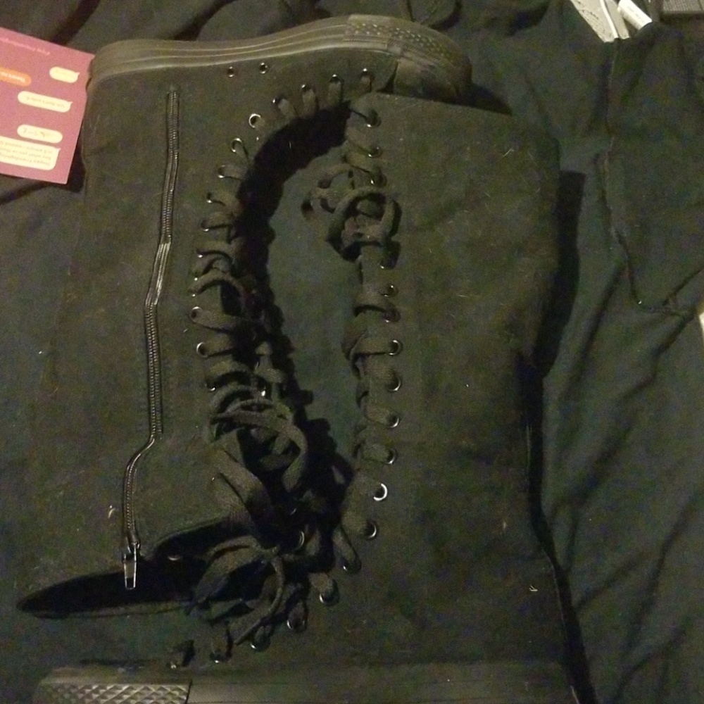 Black knee high shoes.